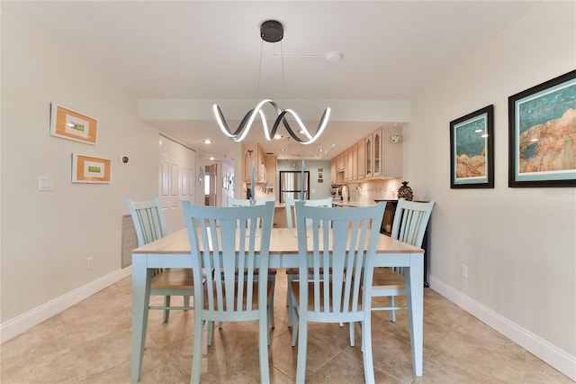 dining area featuring light tile patterned flooring