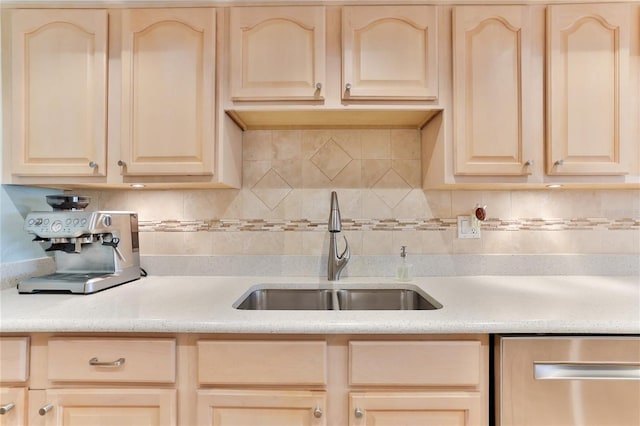 kitchen with light brown cabinets, dishwasher, sink, and tasteful backsplash