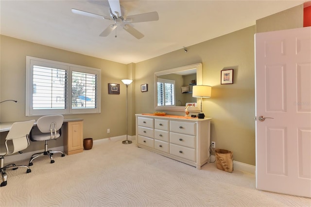 carpeted office with ceiling fan