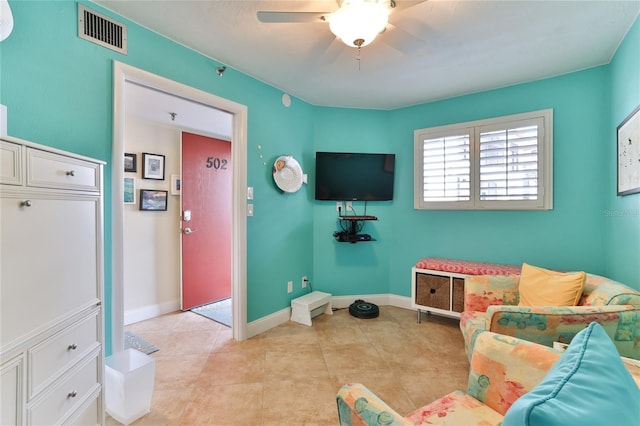 game room with ceiling fan and light tile patterned flooring