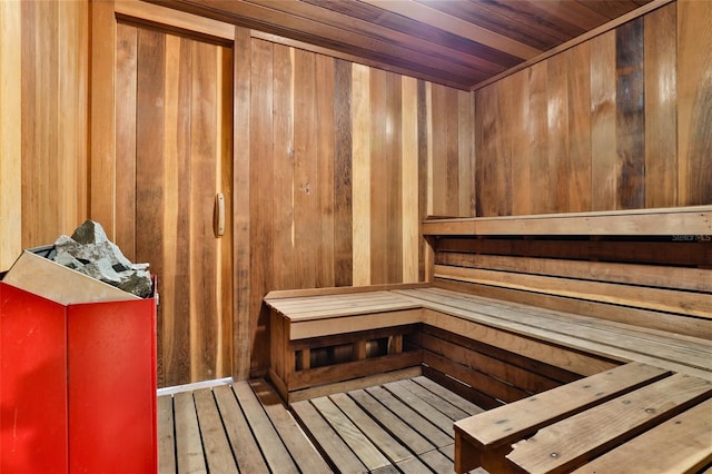 view of sauna with wood ceiling, wood walls, and hardwood / wood-style floors