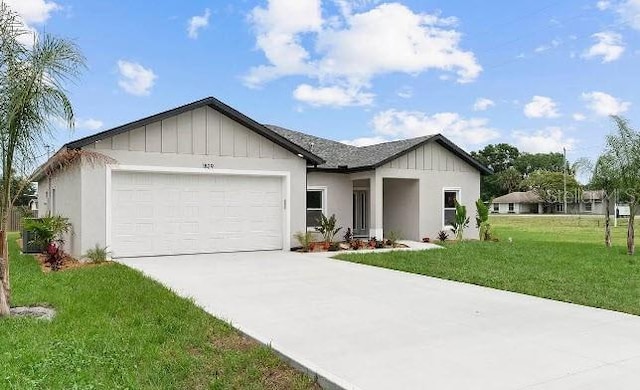 view of front facade with a front yard and a garage