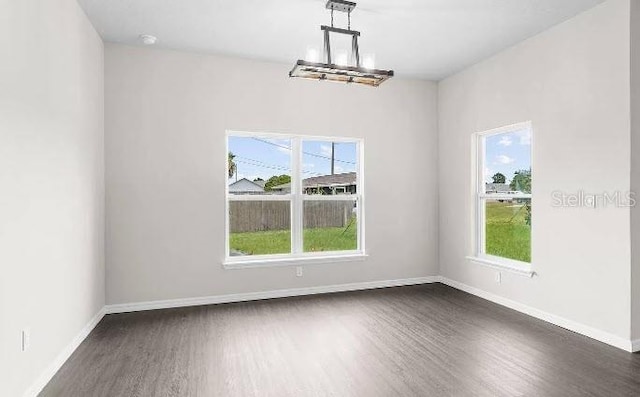 spare room featuring dark hardwood / wood-style floors