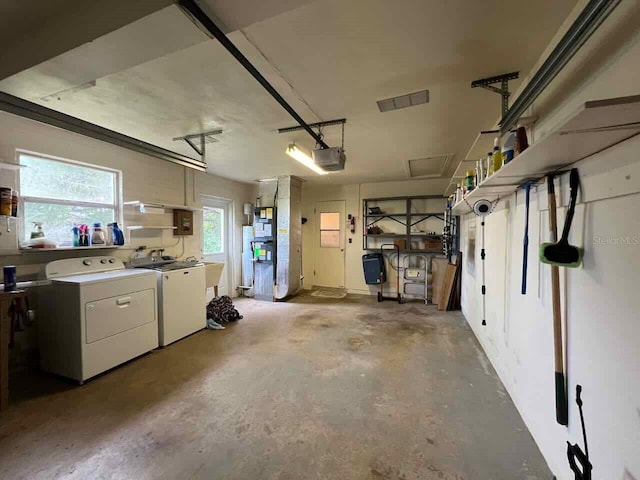 garage featuring a garage door opener and washing machine and clothes dryer