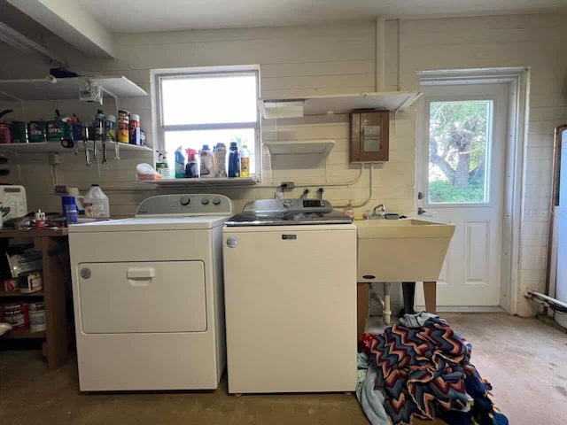 laundry area with washing machine and clothes dryer