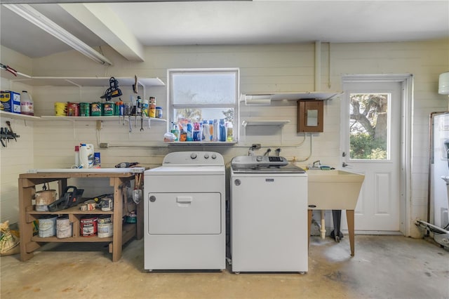 laundry area with washing machine and clothes dryer