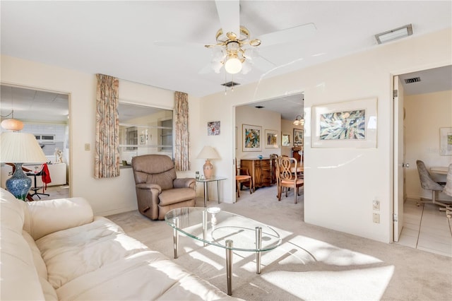 living room featuring ceiling fan and light carpet