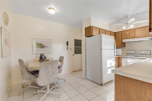 kitchen featuring tasteful backsplash, ceiling fan, white appliances, and light tile flooring