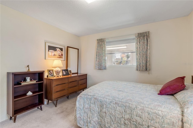 bedroom featuring light carpet