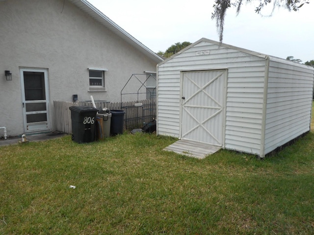 view of outdoor structure featuring a yard