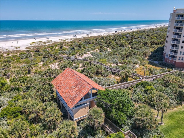 birds eye view of property featuring a water view and a view of the beach