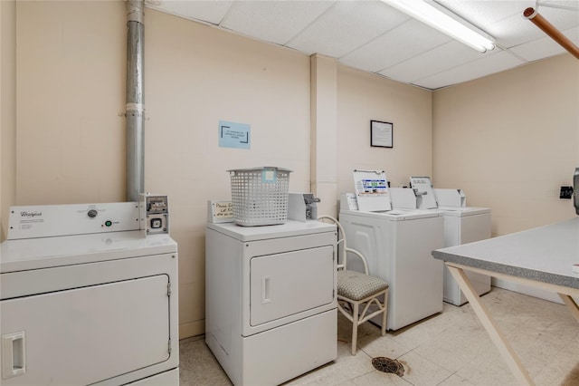 clothes washing area featuring independent washer and dryer