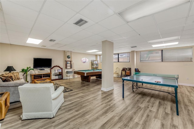 rec room with a paneled ceiling, wood-type flooring, and billiards