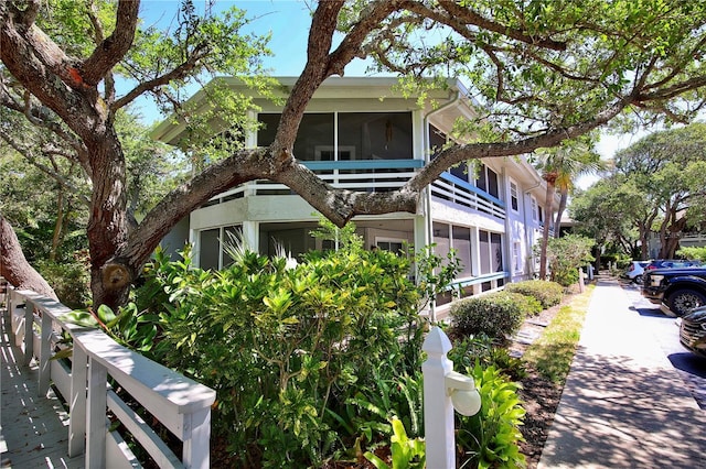 view of front facade with a sunroom