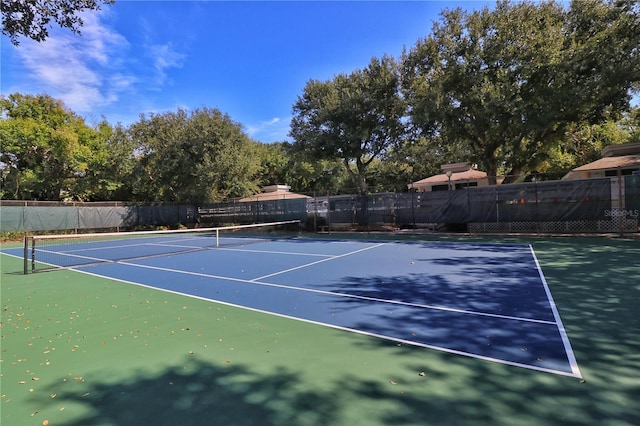 view of sport court with fence