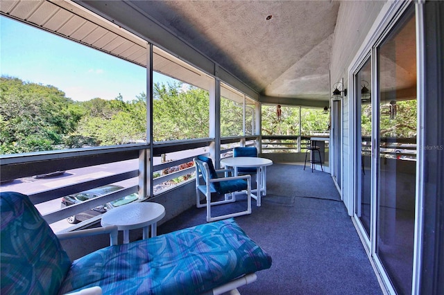 sunroom / solarium with lofted ceiling