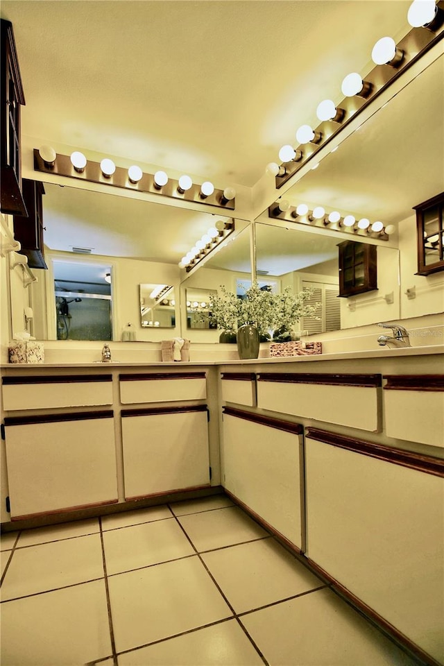 bathroom with tile floors and double sink vanity