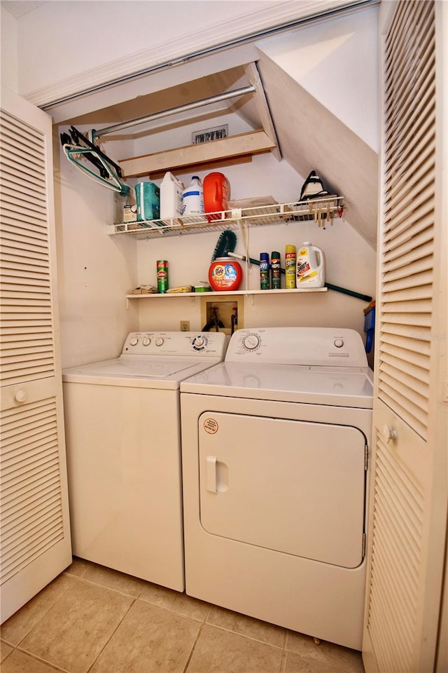 clothes washing area featuring laundry area and washer and dryer