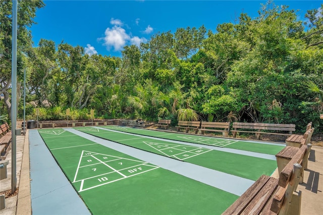 view of property's community featuring shuffleboard