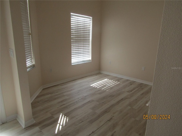 spare room with light wood-type flooring