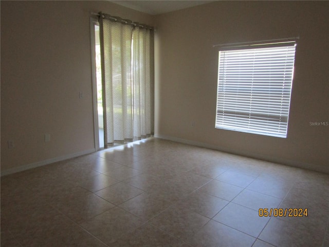 view of tiled spare room