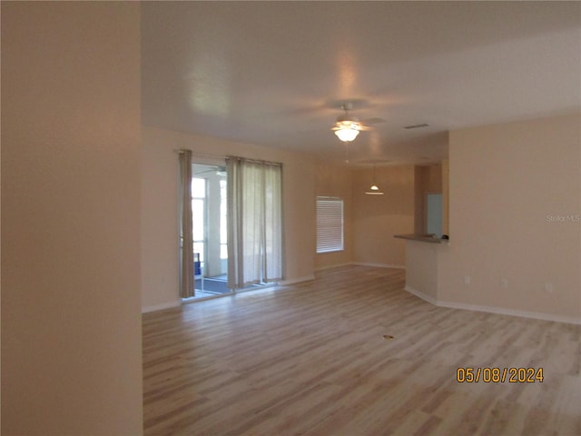 unfurnished room featuring ceiling fan and light hardwood / wood-style floors