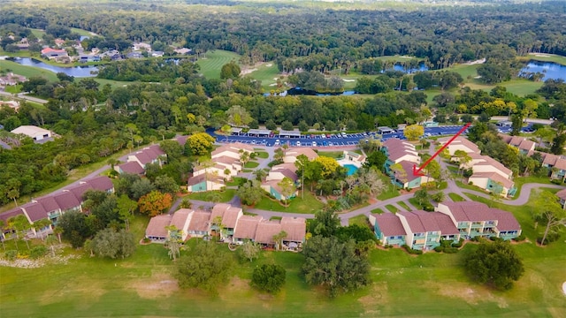 bird's eye view featuring a water view and a residential view