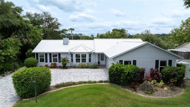 ranch-style home featuring a front yard