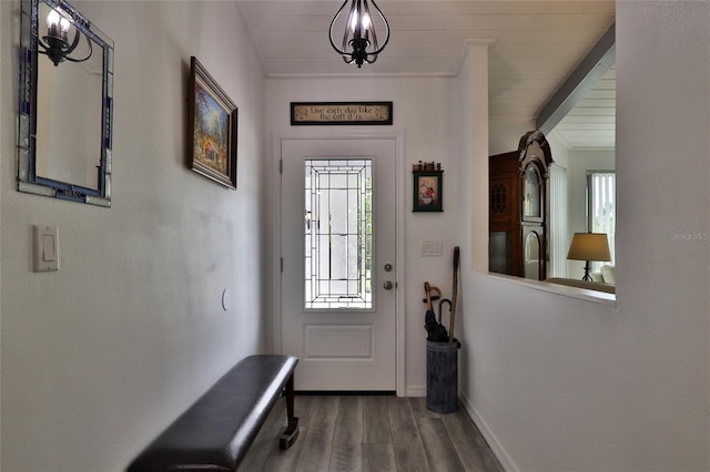 doorway to outside featuring an inviting chandelier, wooden ceiling, and dark hardwood / wood-style flooring