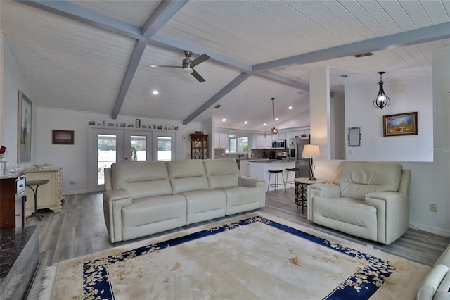 living room with wood ceiling, vaulted ceiling with beams, light wood-type flooring, and ceiling fan