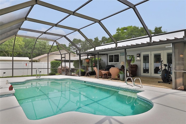 view of swimming pool featuring french doors, a patio, and glass enclosure