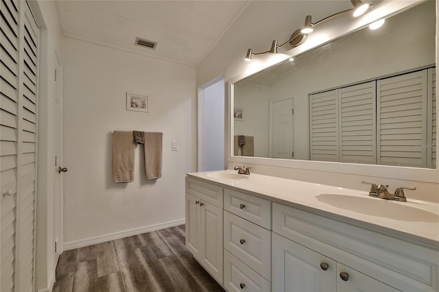 bathroom with vanity and hardwood / wood-style floors