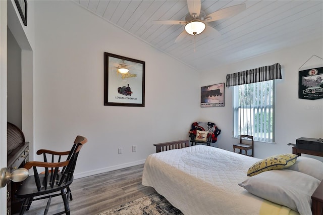 bedroom with vaulted ceiling, wood ceiling, hardwood / wood-style flooring, and ceiling fan