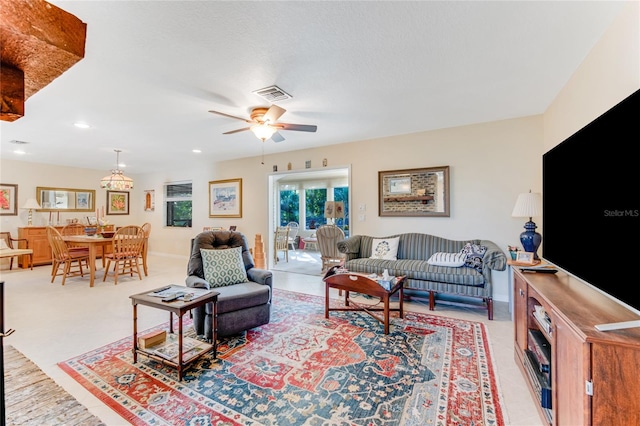 living room with carpet floors and ceiling fan