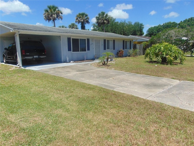 single story home featuring a carport and a front lawn