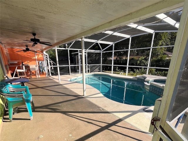 view of pool featuring a lanai, a patio area, and ceiling fan