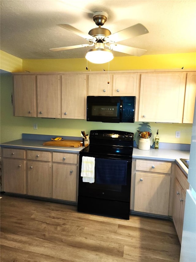 kitchen featuring black appliances, hardwood / wood-style flooring, ceiling fan, and light brown cabinetry