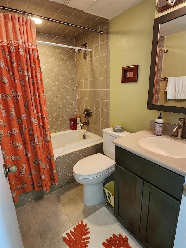 full bathroom featuring tile flooring, toilet, shower / bath combo with shower curtain, and vanity