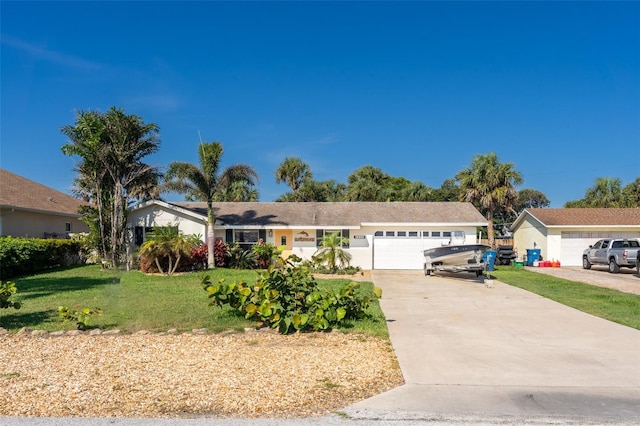 ranch-style house with a front yard and a garage