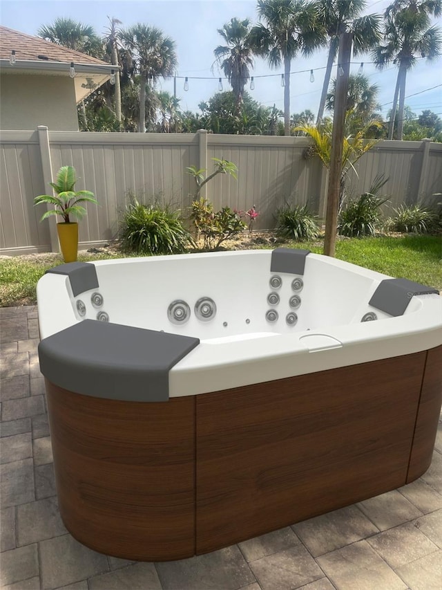 4606 Doris Dr, New Smyrna Beach, FL 32169 - view of patio / terrace featuring a hot tub