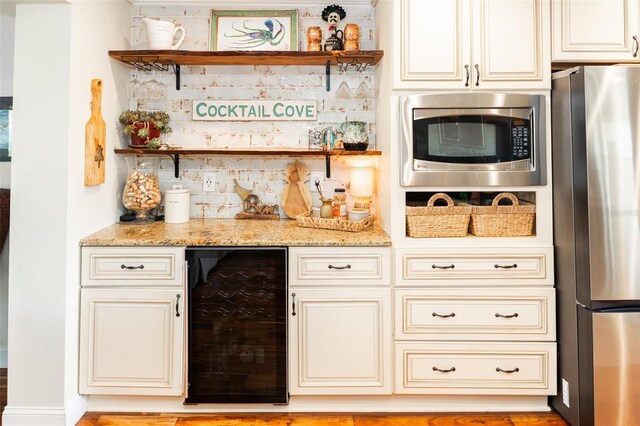 4606 Doris Dr, New Smyrna Beach, FL 32169 - indoor dry bar with stainless steel appliances and beverage cooler