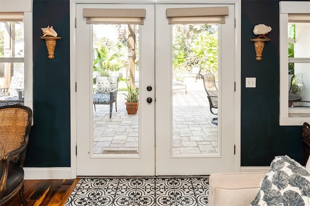 4606 Doris Dr, New Smyrna Beach, FL 32169 - doorway with healthy amount of natural light and wood finished floors