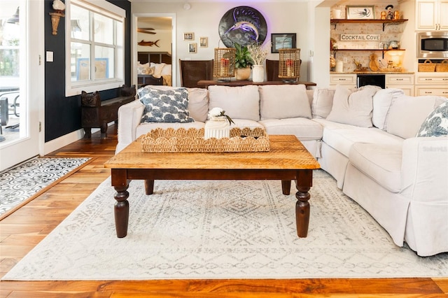 4606 Doris Dr, New Smyrna Beach, FL 32169 - living area with light wood-style floors, wine cooler, and healthy amount of natural light