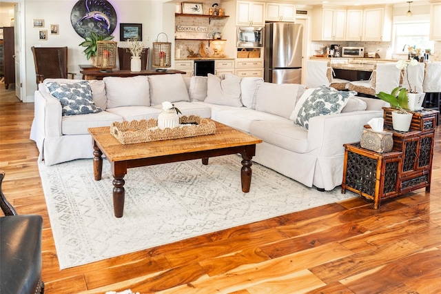4606 Doris Dr, New Smyrna Beach, FL 32169 - living area with beverage cooler and light wood-style floors