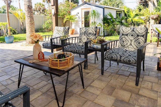 4606 Doris Dr, New Smyrna Beach, FL 32169 - view of patio featuring an outbuilding and an outdoor living space
