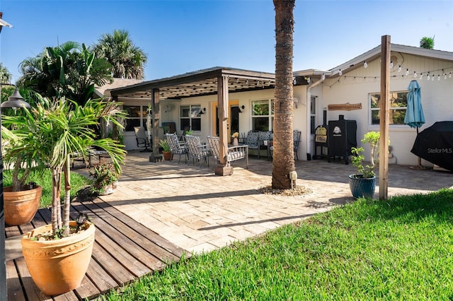 4606 Doris Dr, New Smyrna Beach, FL 32169 - rear view of property with a patio area