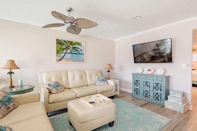 living room featuring crown molding, ceiling fan, and hardwood / wood-style floors