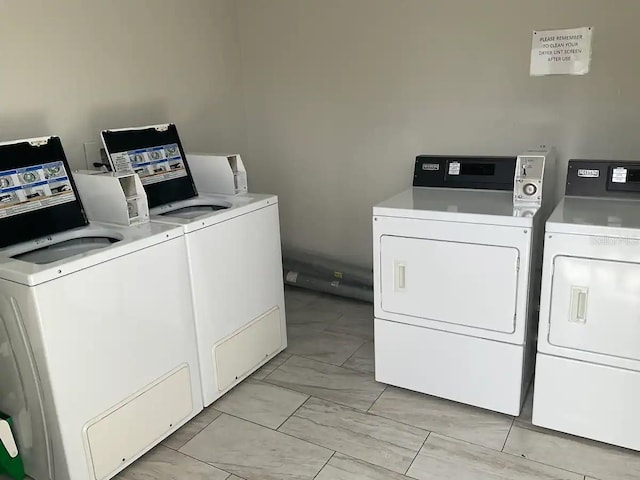 clothes washing area featuring washer and dryer