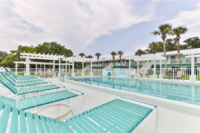 view of pool with a pergola and a patio area