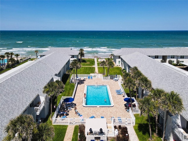 bird's eye view featuring a water view and a view of the beach